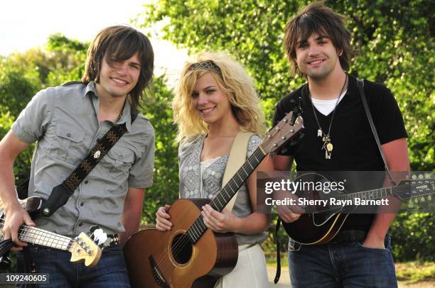 Reid Perry, Kimberly Perry and Neil Perry from the musical group The Band Perry pose for a photo at the Golf and Guitars charity event on May 18,...