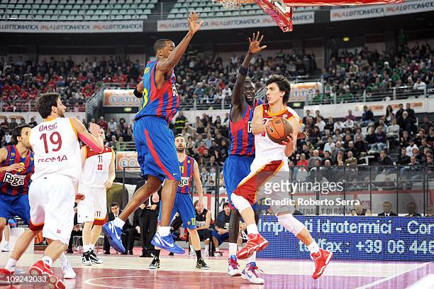 Nihad Djedovic of Lottomatica Roma in action against Terence Morris and Boniface Ndong of Regal FC Barcelona during the 2010-2011 Turkish Airlines...