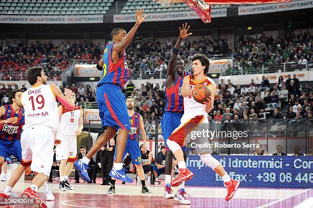 Nihad Djedovic of Lottomatica Roma in action against Terence Morris and Boniface Ndong of Regal FC Barcelona during the 2010-2011 Turkish Airlines...