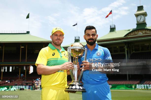 Captains Aaron Finch of Australia and Virat Kohli of India pose with ICC Cricket World Cup trophy during the Australia v India ODI Series Captains...