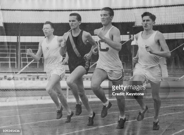 Athletes from Oxford, Cambridge, Cornell and Princeton, in training at White City for their upcoming race, London, 27th June 1950. From left to...