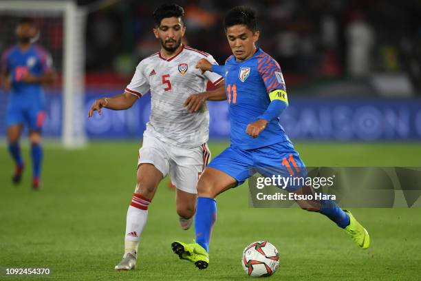 Sunil Chhetri of India and Amer Abdulrahman Abdulla of United Arab Emirates compete for the ball during the AFC Asian Cup Group A match between India...