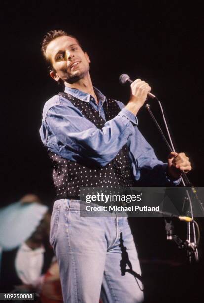 Miguel Bose performs on stage, London, 1991.