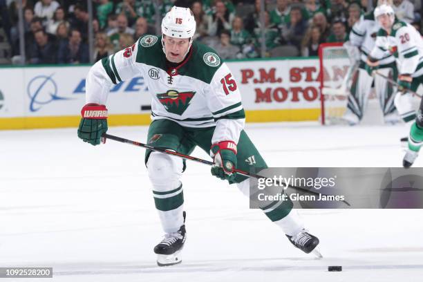 Matt Hendricks of the Minnesota Wild handles the puck against the Dallas Stars at the American Airlines Center on February 1, 2019 in Dallas, Texas.