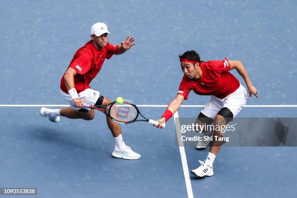 Yasutaka Uchiyama and Ben Mclachlan of Japan in action in the Men's Doubles match against Gong Mao Xin and Zhang Ze of China on day two of the 2019...