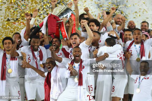 Players of Qatar lifts the AFC Asian Cup trophy following their victory during the AFC Asian Cup final match between Japan and Qatar at Zayed Sports...