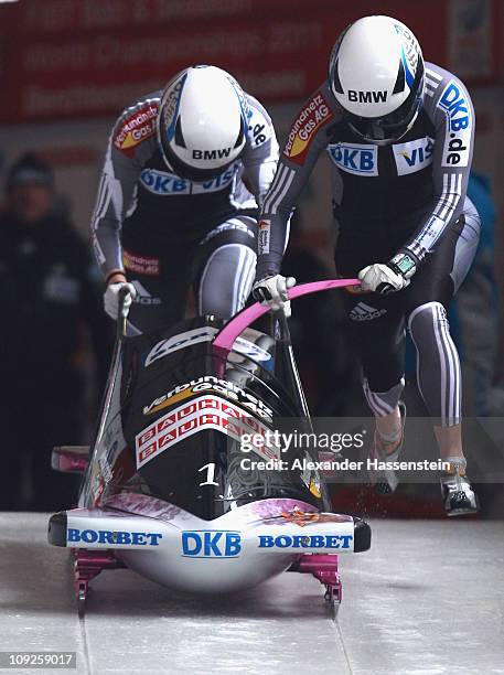 Pilot Sandra Kiriasis and Berit Wiacker of Team Germany 1 starts at the second run of the women's Bobsleigh World Championship on February 18, 2011...