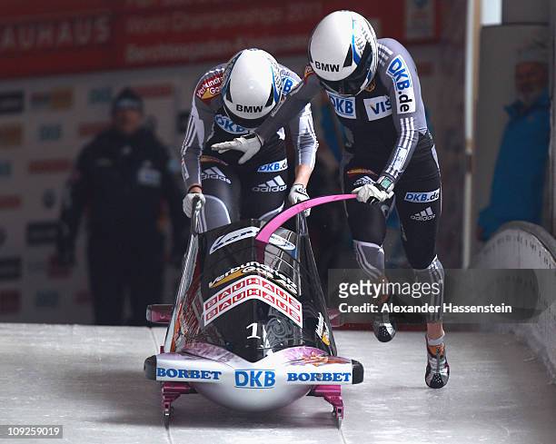 Pilot Sandra Kiriasis and Berit Wiacker of Team Germany 1 starts at the second run of the women's Bobsleigh World Championship on February 18, 2011...