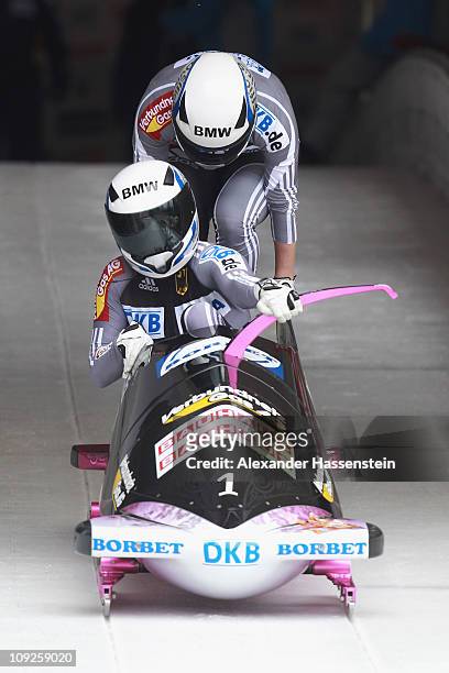 Pilot Sandra Kiriasis and Berit Wiacker of Team Germany 1 starts at the second run of the women's Bobsleigh World Championship on February 18, 2011...