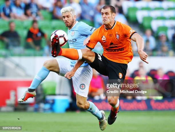 Luke Brattan of the City competes for the ball against against Luke DEVERE of Brisbane Roar during the round 13 A-League match between Melbourne City...