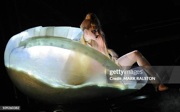 Lady Gaga steps out of a translucent egg to performs at the 53rd annual Grammy Awards show at the Staples Center in Los Angeles on February 13, 2011....