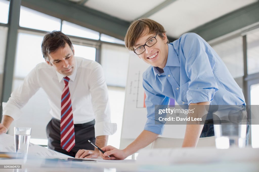 Two businessmen working on paperwork