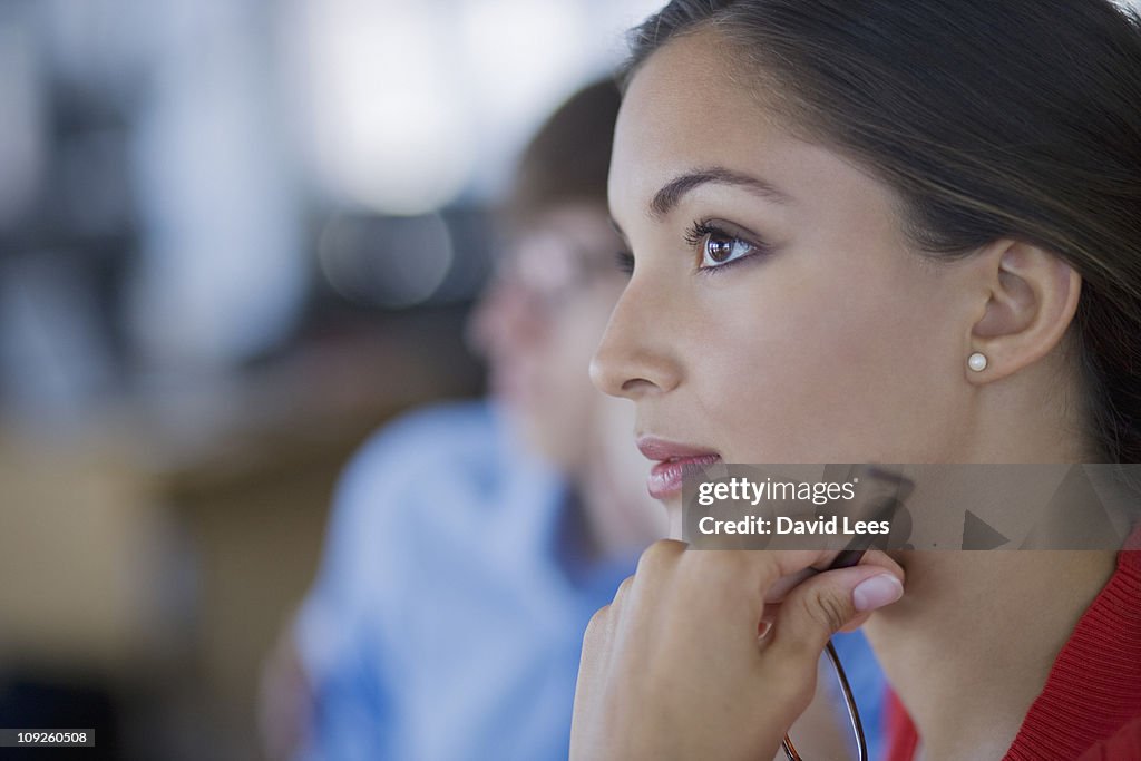 Businesswoman in meeting, close up