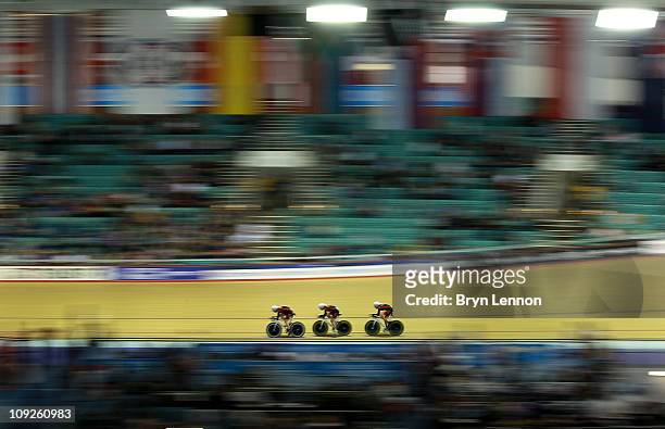 Sarah Hammer, Dotsie Bausch and Jennie Reed of the USA and the Ouch Pro Cycling team compete in the Women's Team Pursuit qualification during day one...