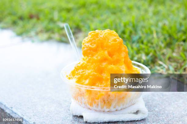 kakigori, japanese shaved ice with  mango puree - mango shaved ice stock pictures, royalty-free photos & images