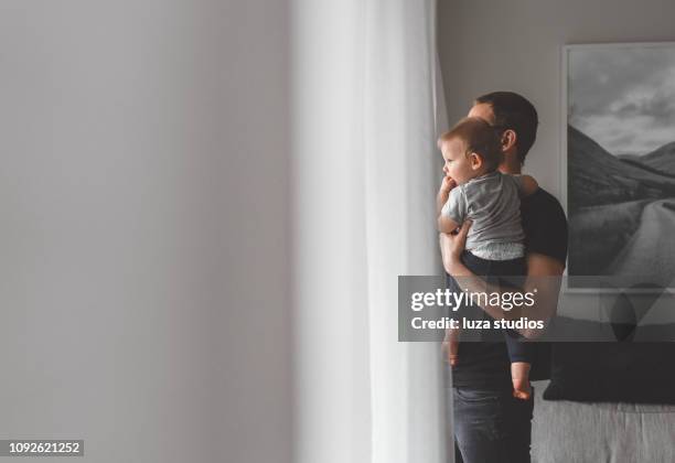 stay at home father with his baby son - scandinavia stock pictures, royalty-free photos & images