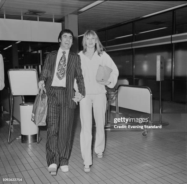 British drummer Keith Moon with his partner, Swedish fashion model Annette Walter-Lax, at the airport, UK, 1st May 1975.