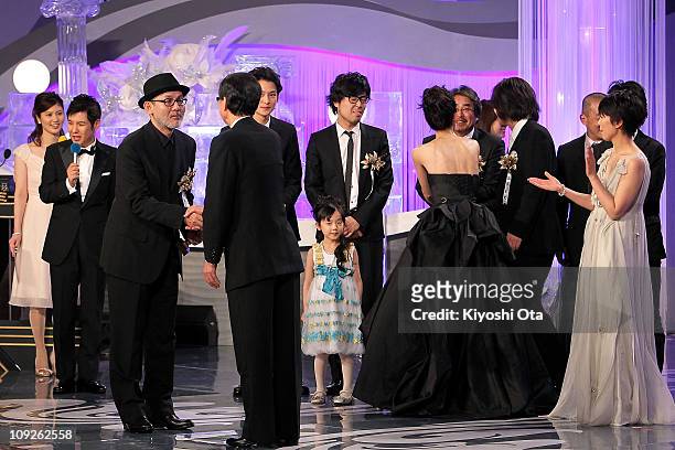 Director Tetsuya Nakashima accepts the award for Best Picture for 'Kokuhaku' on stage during the 34th Japan Academy Awards at Grand Prince Hotel New...
