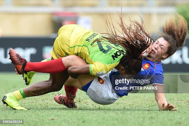 France's Caroline Drouin is tackled by Australia's Ellia Green in the women's Rugby Sevens tournament in Sydney on February 2, 2019. / -- IMAGE...