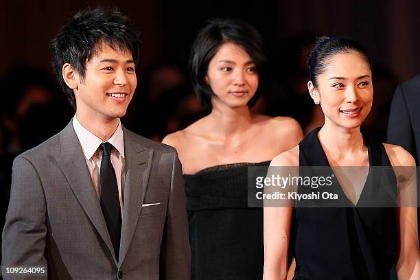 Actor Satoshi Tsumabuki , who won the award for Best Actor in a Leading Role for 'Akunin ', arrives for the 34th Japan Academy Awards with actresses...