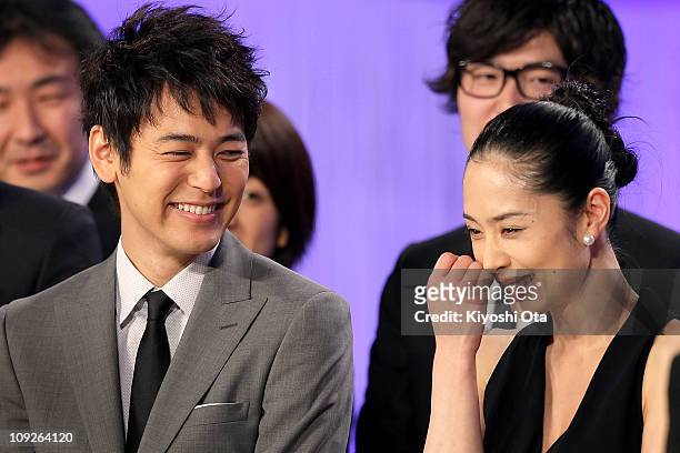 Actor Satoshi Tsumabuki , who won the award for Best Actor in a Leading Role for 'Akunin ', and actress Eri Fukatsu, who won the award for Best...