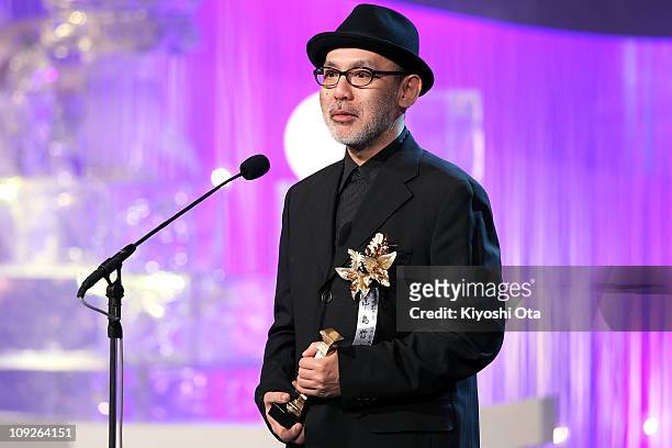 Director Tetsuya Nakashima speaks on stage as he accepts the award for Best Director for 'Kokuhaku ' during the 34th Japan Academy Awards at Grand...