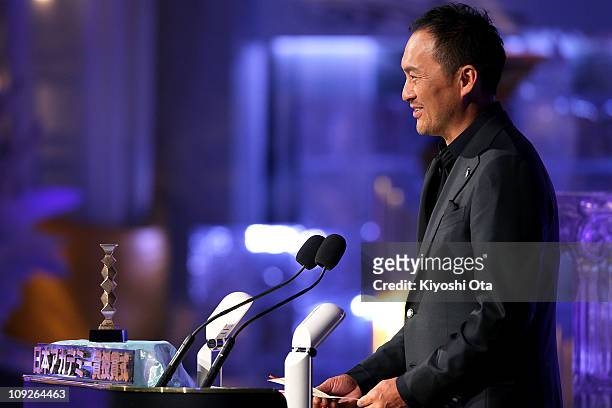 Actor Ken Watanabe presents the award for Best Actress In A Leading Role on stage during the 34th Japan Academy Awards at Grand Prince Hotel New...