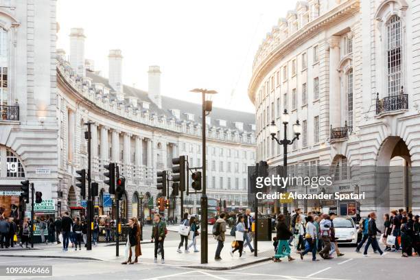 piccadilly circus and regent street in london, england, uk - high street stock pictures, royalty-free photos & images