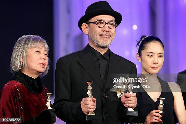 Actress Kirin Kiki, director Tetsuya Nakashima and actress Eri Fukatsu pose during the 34th Japan Academy Awards at Grand Prince Hotel New Takanawa...
