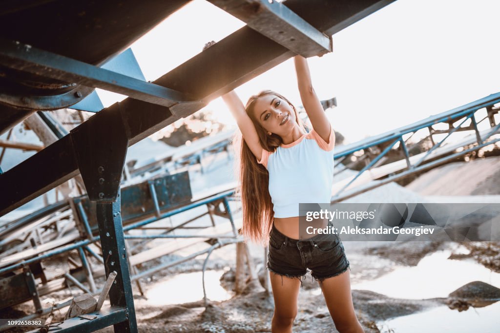 Portrait Of Beautiful Female Standing On Abandoned Construction Site