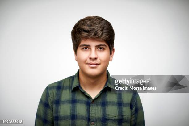 confident teenage boy on white background - boy portrait studio stock pictures, royalty-free photos & images