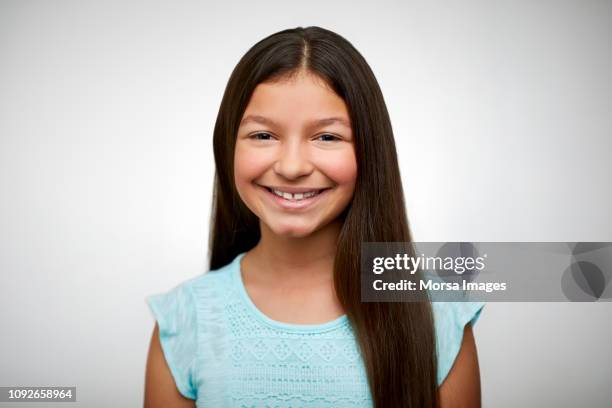 portrait of girl smiling on white background - south american culture stock pictures, royalty-free photos & images