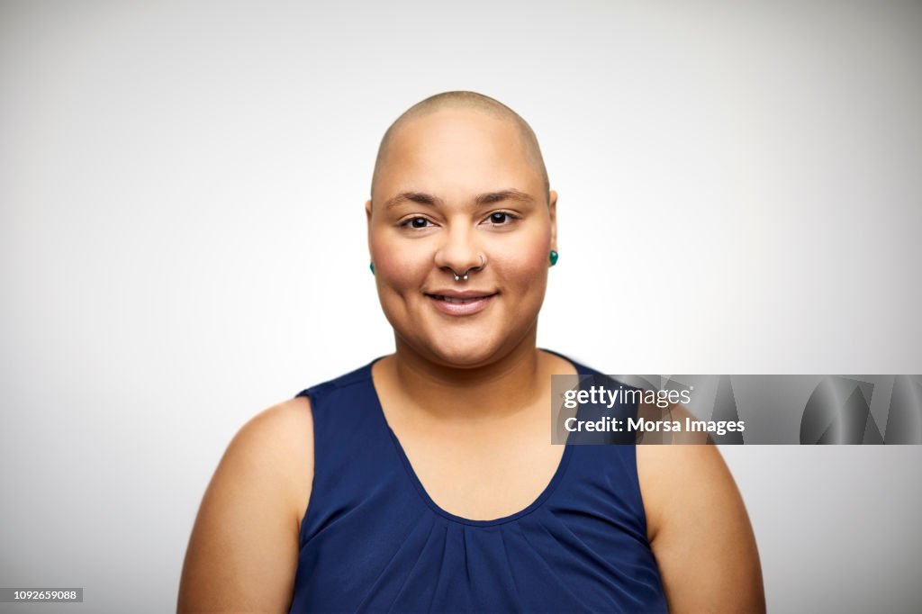 Portrait of confident woman with shaved head