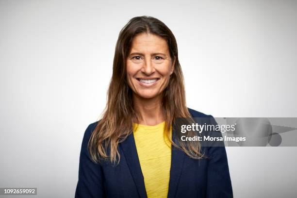 portrait of smiling mature businesswoman - well dressed stock pictures, royalty-free photos & images