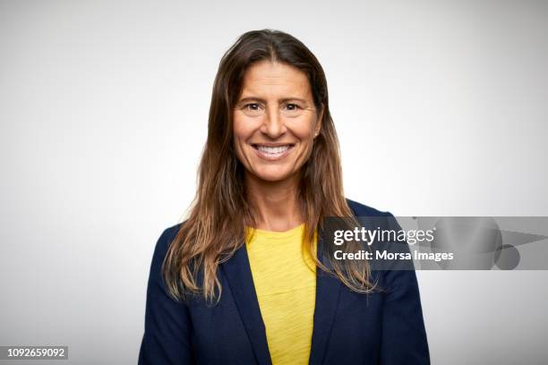 portrait of smiling mature businesswoman - mature person happiness white background stock pictures, royalty-free photos & images