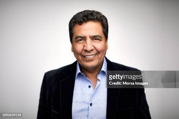 portrait of smiling mature man wearing blazer - 50 59 years stock pictures, royalty-free photos & images