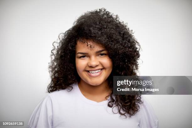 smiling teenage girl on white background - girl white background stock pictures, royalty-free photos & images