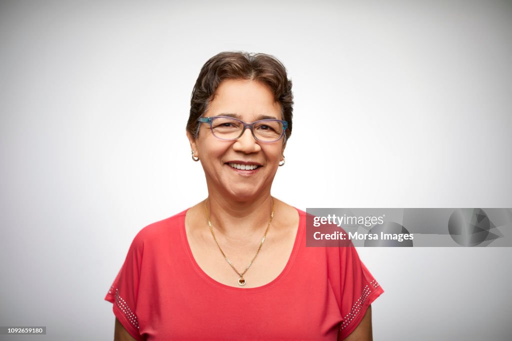 Portrait of happy senior woman wearing eyeglasses