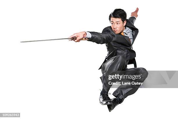 businessman with sword - samurai sword stock pictures, royalty-free photos & images