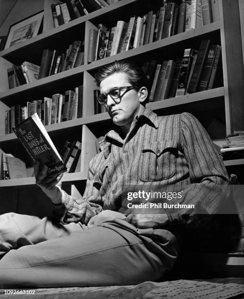 American actor Kirk Douglas reads 'The Last Days of Hitler' by Hugh R. Trevor-Roper at his home, circa 1948. He is starring in the 20th Century Fox...