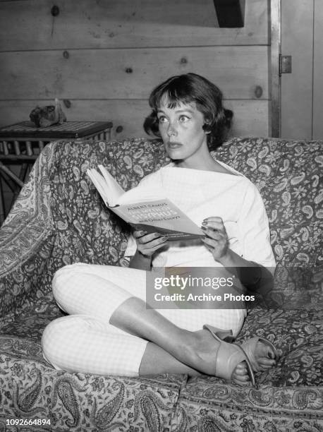 American actress Phyllis Kirk reading 'The Myth of Sisyphus and Other Essays' by Albert Camus, circa 1965.