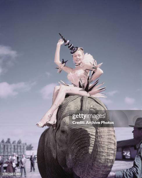 American actress Gloria Grahame in costume as Angel the Elephant Girl during publicity for the Cecil B. DeMille circus film 'The Greatest Show on...