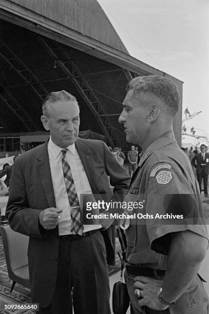 Army officer and diplomat Maxwell Davenport Taylor , the new US Ambassador to South Vietnam, talks to an officer of the Military Assistance Advisory...