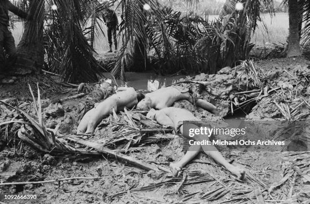 Contains death and graphic content - The naked corpses of Viet Cong fighters in South Vietnam, during the Vietnam War, 1st February 1965.