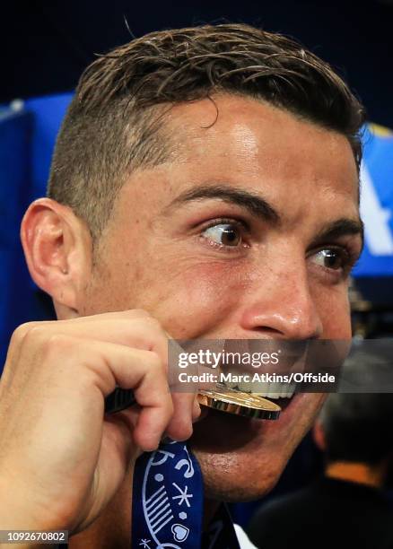 July 2016 - UEFA EURO 2016 Final - Portugal v France - Cristiano Ronaldo of Portugal celebrates, biting his winners medal - .