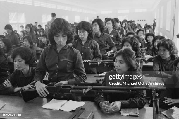 Female paramilitary volunteers are given weapons training in South Vietnam, during the Vietnam War, March 1962.