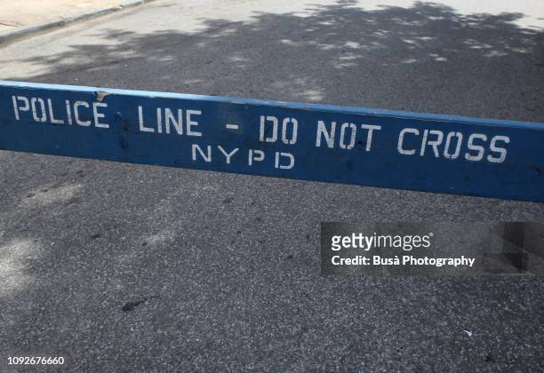 "police line - do not cross" nypd fence in the streets of new york city, usa - nypd stock pictures, royalty-free photos & images