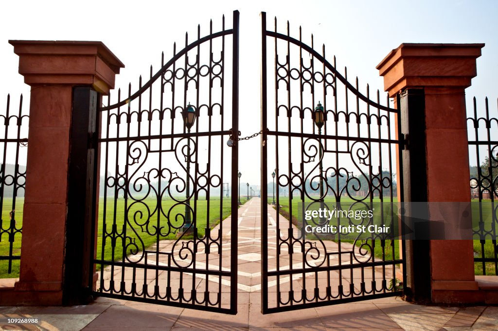 Large iron gates secured with padlock