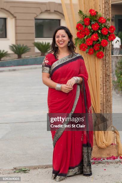 smiling mixed race woman in indian clothing - 民族衣装 ストックフォトと画像