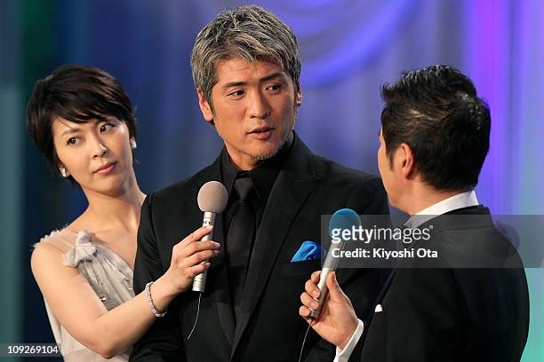 Actor and singer Koji Kikkawa appears on stage during the 34th Japan Academy Awards at Grand Prince Hotel New Takanawa on February 18, 2011 in Tokyo,...